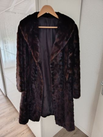 Manteau en fourrure taille L
