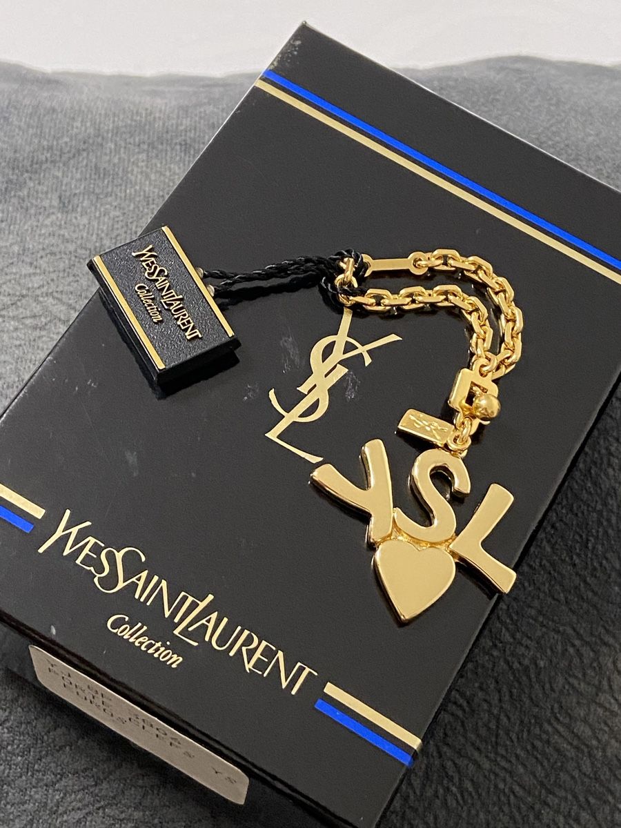 Saint Laurent Ciondoli: Bijoux de sac Yves Saint Laurent – Usato da Montreux venduto da Perledor