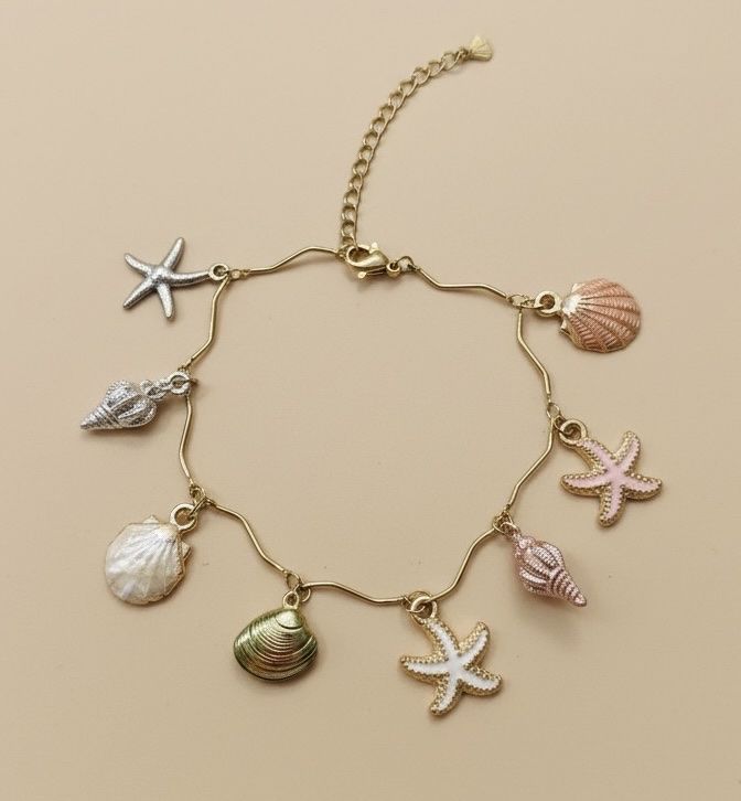 Bracciali & Braccialetti: Summer Ready: Seashell & Starfish Charm Bracelet, New – Nuovo e nell'imballaggio originale da Saland venduto da ele_vc96