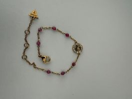 🤩 Bracciale Guess dorato con pietre rosa e logo