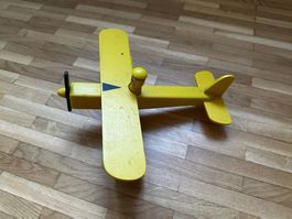 Vintage antique yellow wooden toy airplane