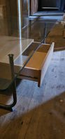 Glastisch mit massivem Mittelblock & Stauraum