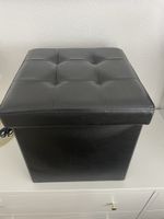 Schwarzer Sitzhocker mit Stauraum