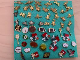 Lot de 55 pins sportifs divers