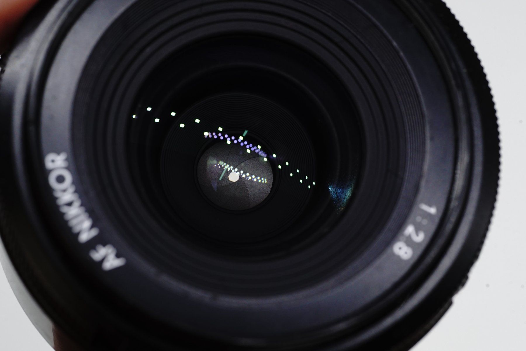Nikon Objektive: AF Nikkor 28mm 1:2.8 – Gebraucht aus Bischofszell von Blende2 4