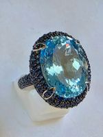 Ring mit Zürichblau Topas und Safiren Gr. 61