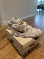 Air Jordan 1 Low Gold Metallic Swoosh