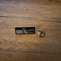 Pin’s Université de Lausanne UNIL – émail noir/doré 