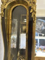 Pendule de style Louis XV en marqueterie Boulle