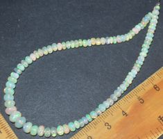 Opal Strang L-4860 – Äthiopische Opal Rondellen 21 cm