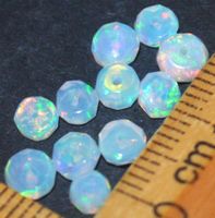 Mineralien Set L-3816 – 11 Stück fac. äthiopischer Opal Rond