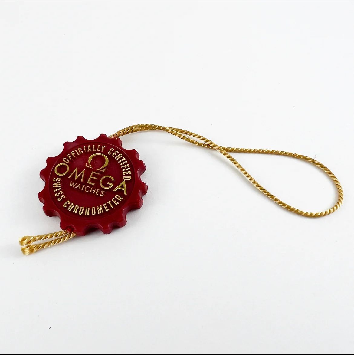 Omega Altri accessori per orologi: Tag Omega rouge  – Nuovo e nell'imballaggio originale da La Chaux-de-Fonds venduto da mih_t8qk
