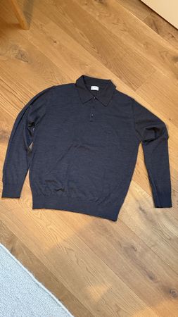 Charcoal polo made from merino wool.