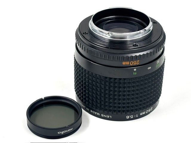 Minolta Obiettivi: Minolta RF Rokkor 250mm 5.6 Mirror / Spiegel – Usato da Seewis Dorf venduto da Plebejus 7