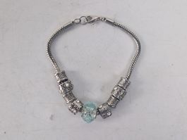 Armband silberfarben mit Charms und blauem Glas-Element