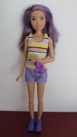 Barbie Puppe mit lila Strähnen