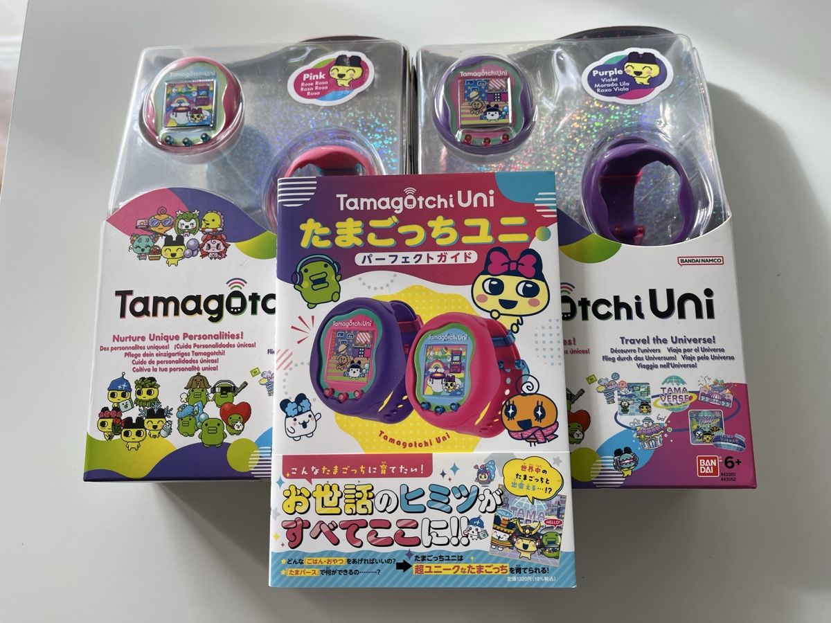 Bandai Spielzeuge: Tamagotchi Uni Pink & Purple + Official JP guide – Gebraucht aus Esslingen von kra_7lvr