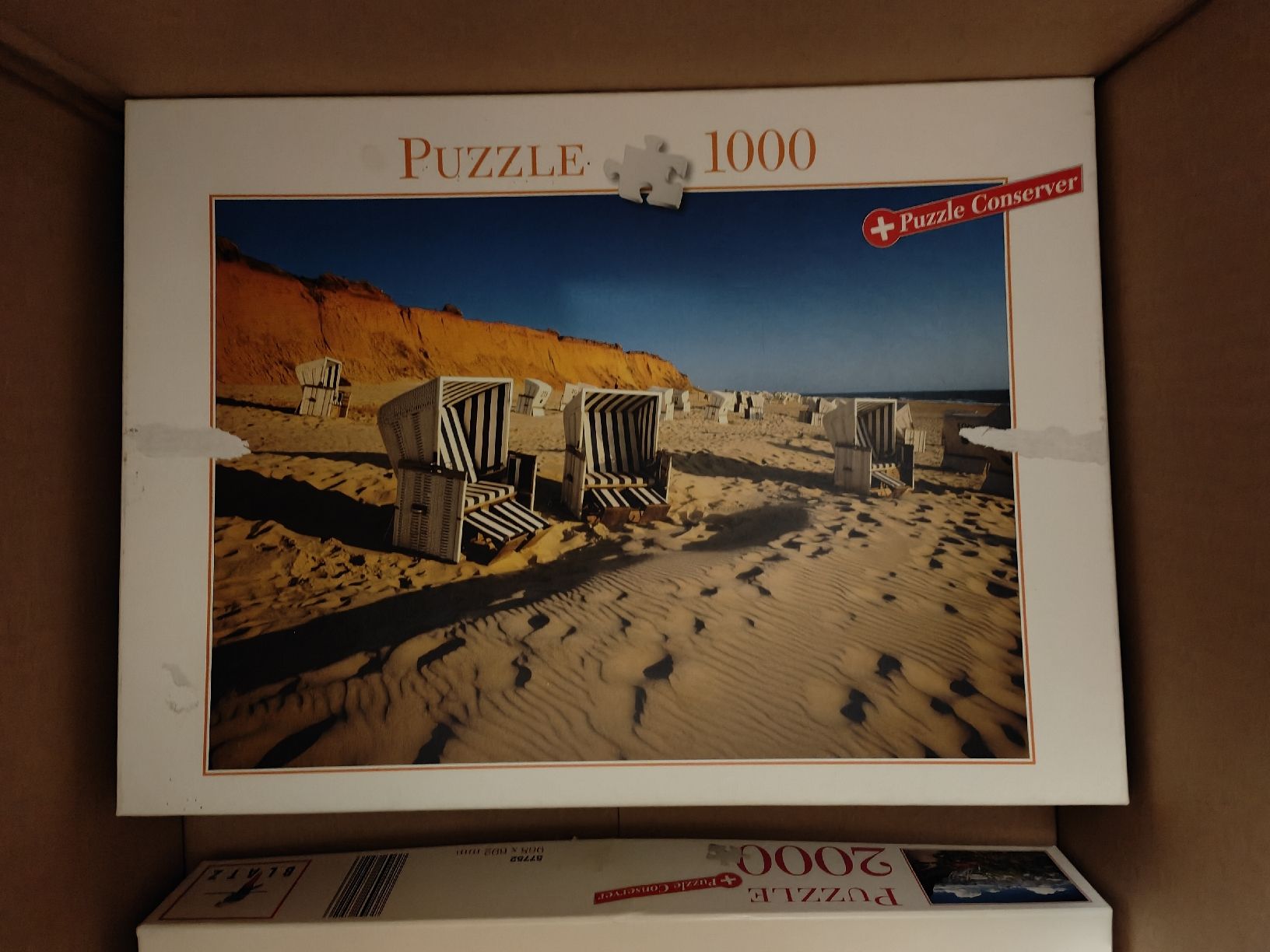 Puzzle: Puzzle 1000 Teile, Strandkörbe am Meer – Usato da Niederhasli venduto da 8155irae