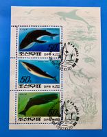 Briefmarke aus Nordkorea Wale und Delfine gestempelt