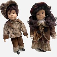 Coppia di bambole in porcellana da collezione stile vintage