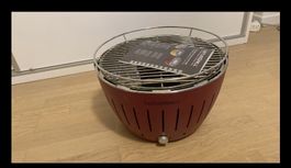 Lotus Grill Holzkohlegrill rot mit Tragetasche 