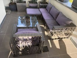 Lounge-Set aus Polyrattan mit Glastisch