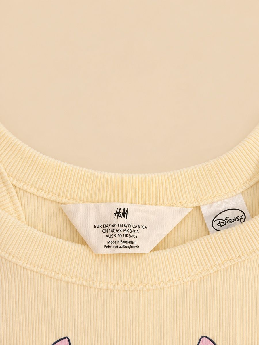 Disney Blouses, T-shirts & Tops: DÉBARDEUR JAUNE DISNEY STITCH – Neuf (Voir description) à Lausanne par mar_6snp 1