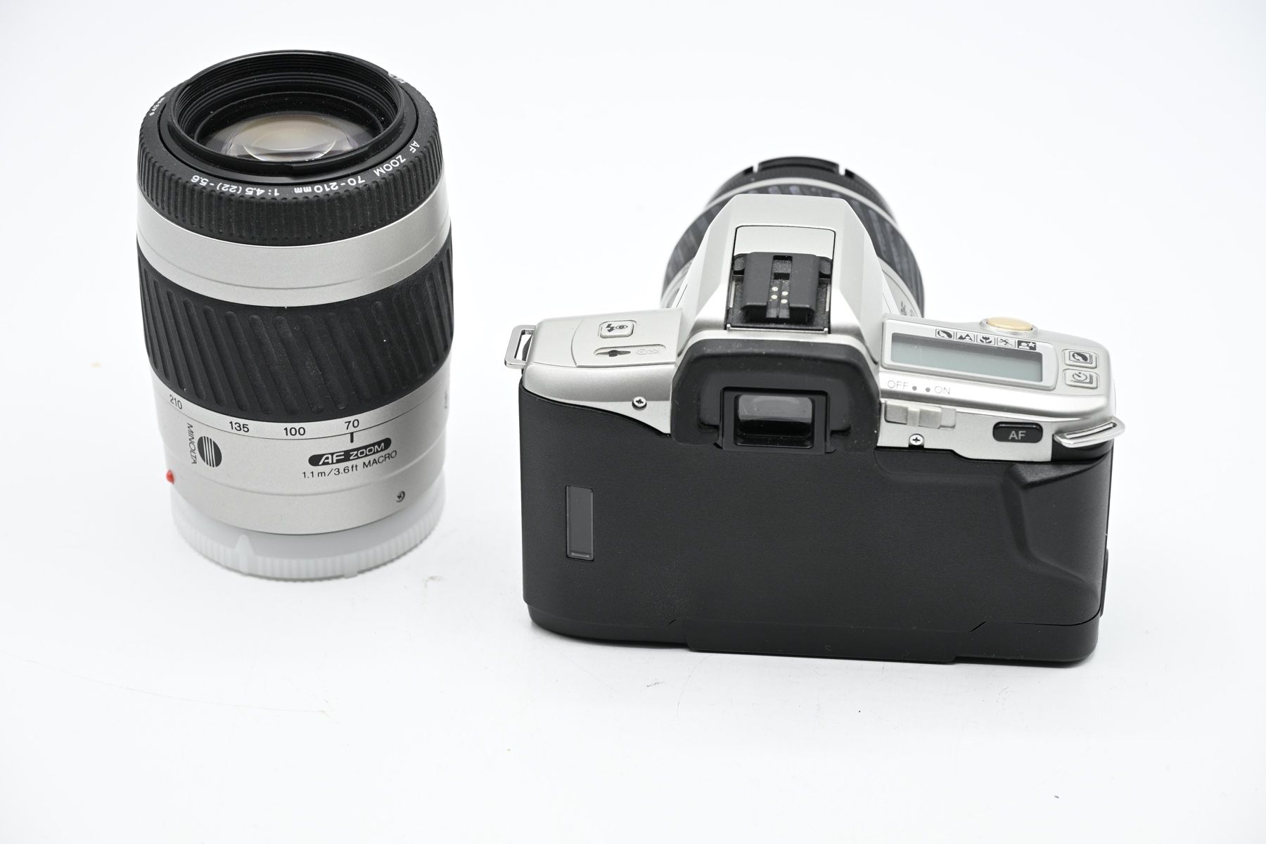 Minolta Fotocamera: Minolta Dynax 3L + 35-80mm + 70-210mm, Argento – Usato da Bellinzona venduto da CarpiFotoSA 1