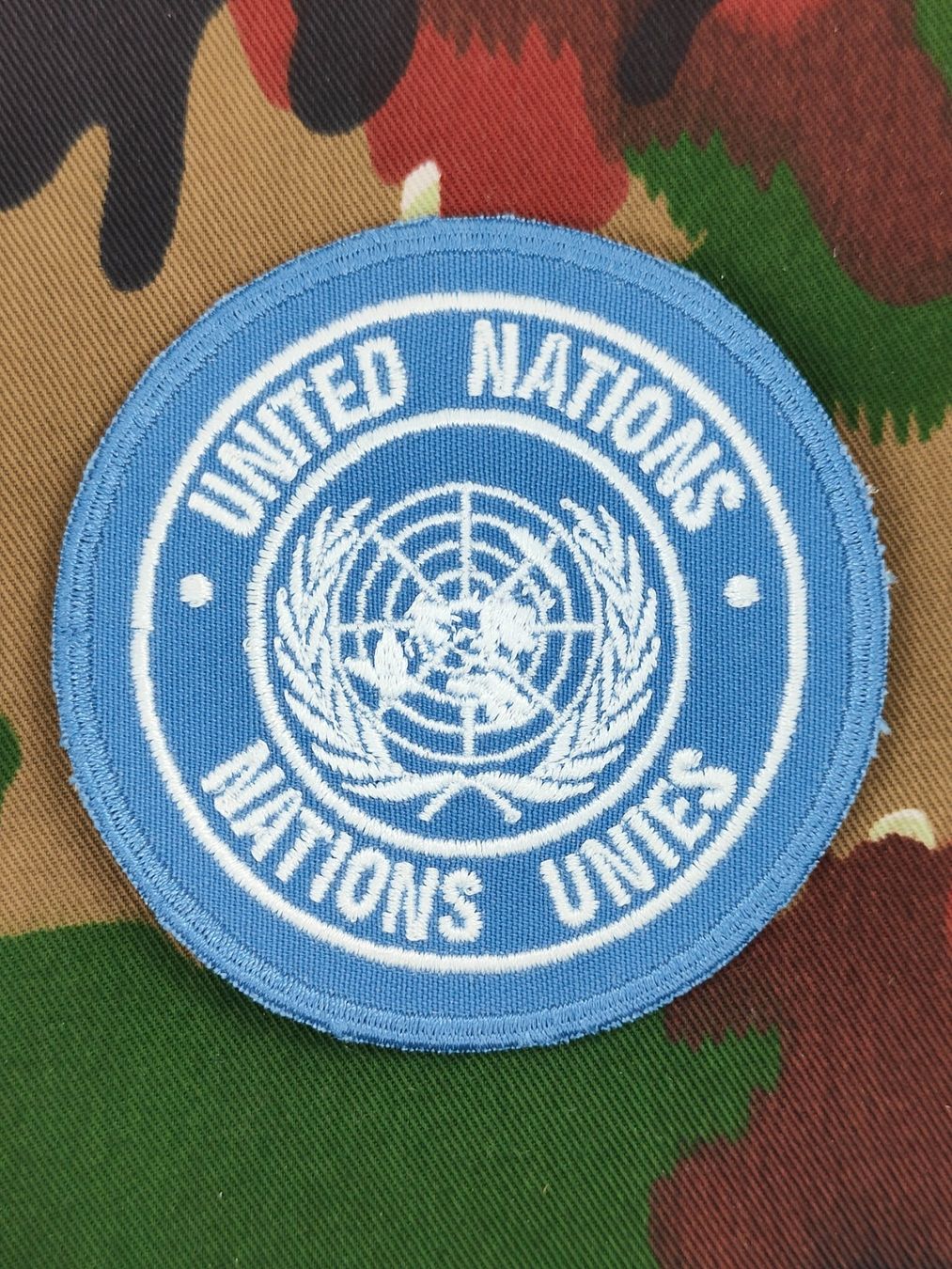 Schweizer Armee Placchette & Badge: Verbandsabzeichen UNITED NATIONS, Variante 2 – Usato da Bauma venduto da SwissMilitaria