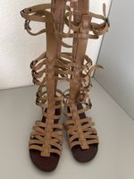 Sandales gladiateur montantes en cuir beige