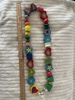 Kette aus Holz für Kinderwagen