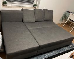 Schlafsofa grau mit Bettkasten in gutem Zustand