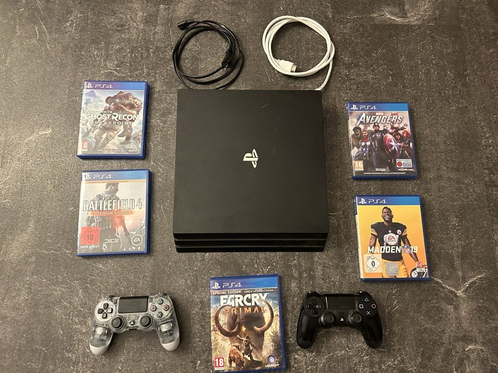 PlayStation 4 Pro 1To + 2 Manettes + Oreillette + Jeux – Occasion (Comme Neuve)