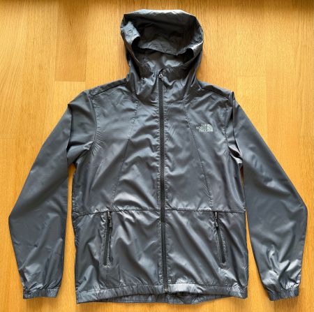 Veste coupe-vent homme  The North Face. Taille M. Gris foncé