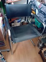 4 poltrone vintage in pelle nera e acciaio cromato anni 70