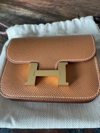 Hermès Constance Slim Portemonnaie in gold
