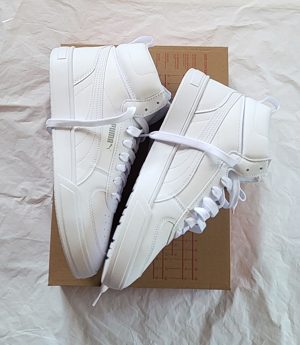 Puma Scarpe da uomo: Puma Caven Mid, blanches, taille 42.5, état  neuf – Nuovo (secondo la descrizione) da Niedergösgen venduto da Eva2410 5