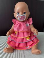 BABY born Puppe mit grossem Kleiderpaket und Schnuller