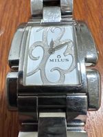 Montre de luxe Milus femme,acier inoxydable,très bon état.45