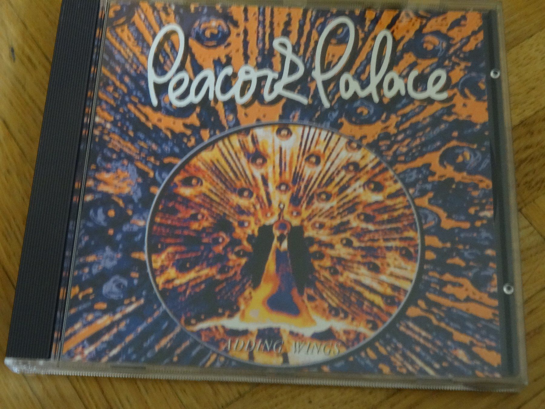 CD: Peacock Palace - Adding Wings CD – Usato da Olten venduto da Disc-Ausverkauf