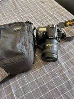 Nikon D7000 + AF-S DX Nikkor 18–200mm VR II + sac Lowepro
