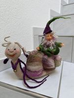 Gefilzte Schnecke mit Zwerg. Handarbeit.