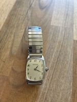 Montre femme Edox cadran clair bracelet extensible métal