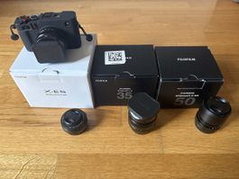 Fujifilm X-E5 camera body with 4 lenses