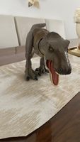 Gut erhaltener T-Rex Din Spielzeug,drucken auf dem Rücken
