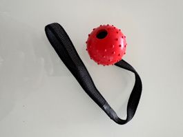 Balle rouge avec sangle pour chien NEUF