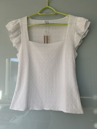 Top neuf blanc à volants - Élégant pour l'été! Taille L