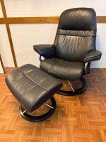 Bequemer Stressless Sessel mit Hocker, Leder, schwarz