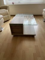 Table basse design bois et verre sur roulettes