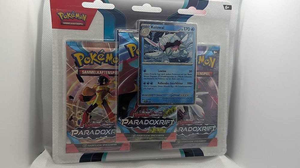 Pokémon – Pack De 3 Boosters Carmesin & Pourpre – Paradoxrift – 10 Cartes + énergie, 1 Promo Colowal, 1 Code